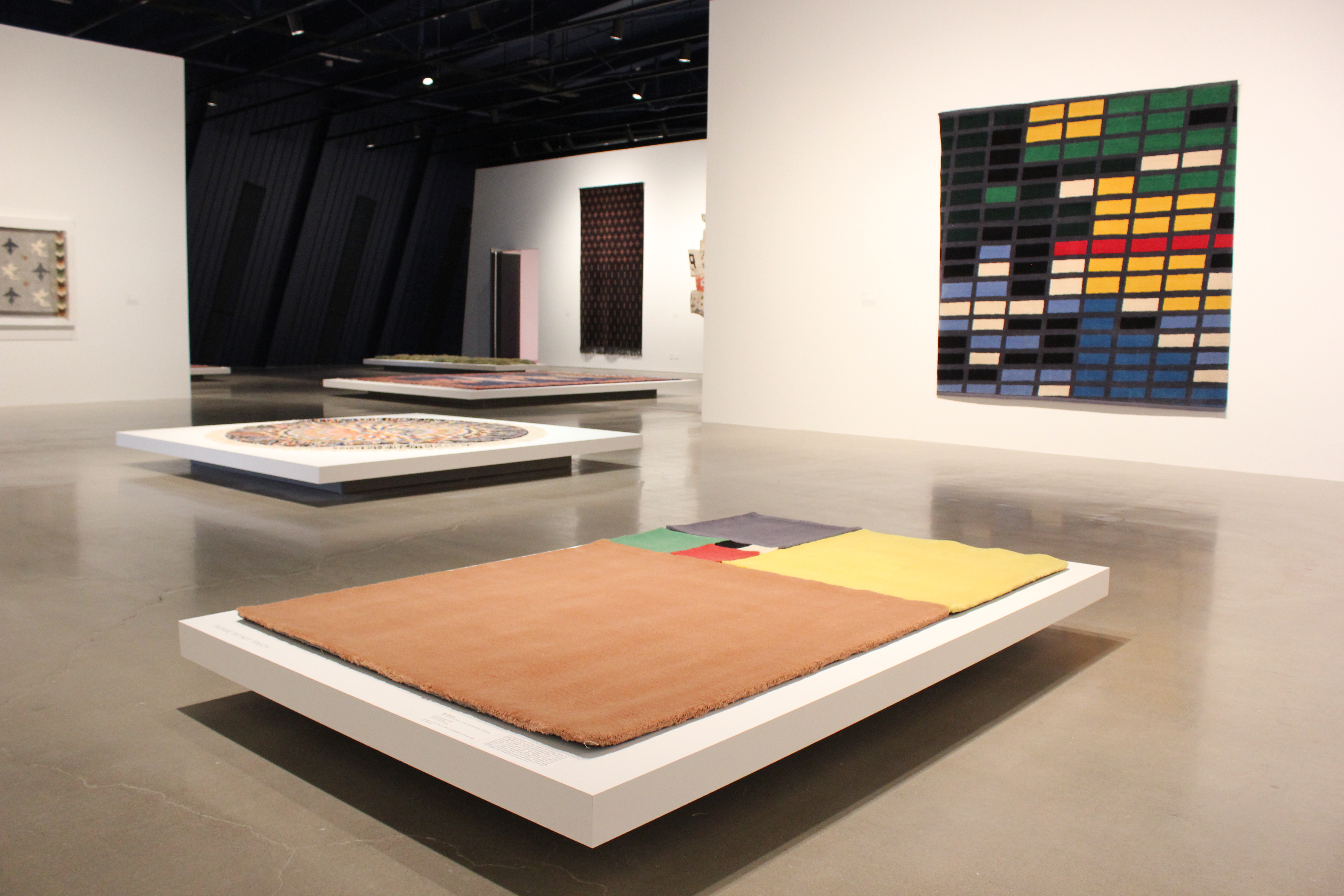 In the foreground, “Infinite Carpet” by Pierre Bismuth, a nod to mathematics’ Fibonacci series, is one of many carpets featured in MOCA Cleveland’s fall exhibition, “Wall to Wall: Carpets by Artists.”